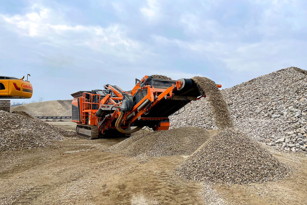 Rockster compact and mobile impact crusher processing river rock