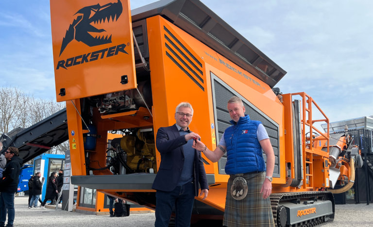 Rockster CEO Norbert Feichtinger with KoncassToo CEO Grant Johnston in front of a brand new Rockster crusher at the bauma 2025